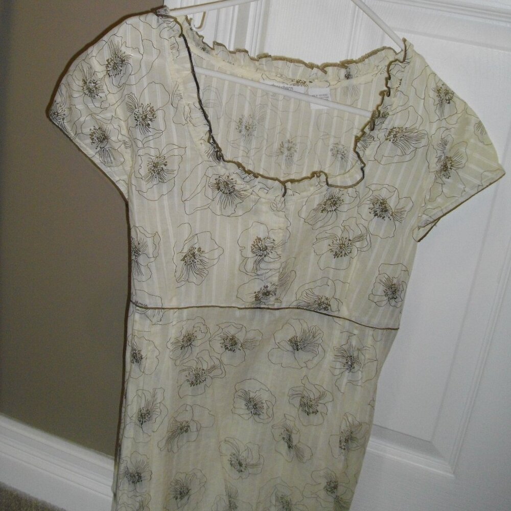 Dress Barn cream and back. tie around back, short sleeved blouse. Like new
